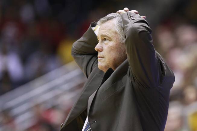 Cal head coach Mike Montgomery puts his hands on his heads after one of his players fouled during the first half of their game against UNLV Sunday, Dec. 9, 2012 at Haas Pavilion in Berkeley, Calif. UNLV won 76-75.