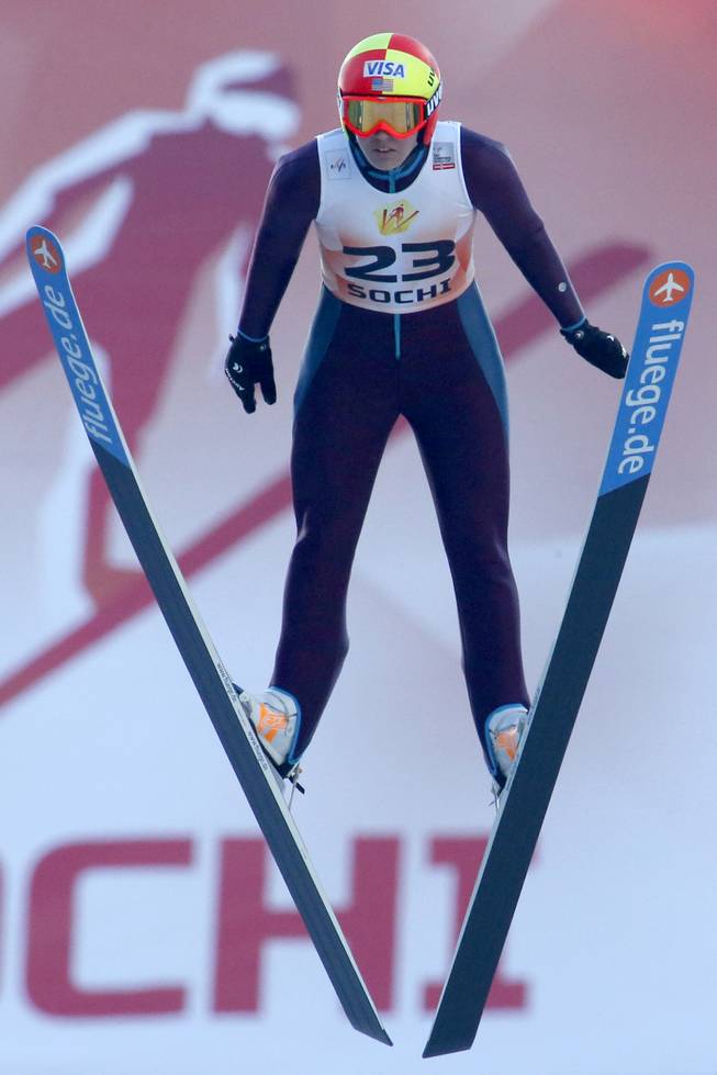 Abby Hughes of the US makes her competition jump during the Women's Normal Hill Individual event at the FIS Ski jumping Cup in Sochi, Russia, Sunday, Dec. 9, 2012. 