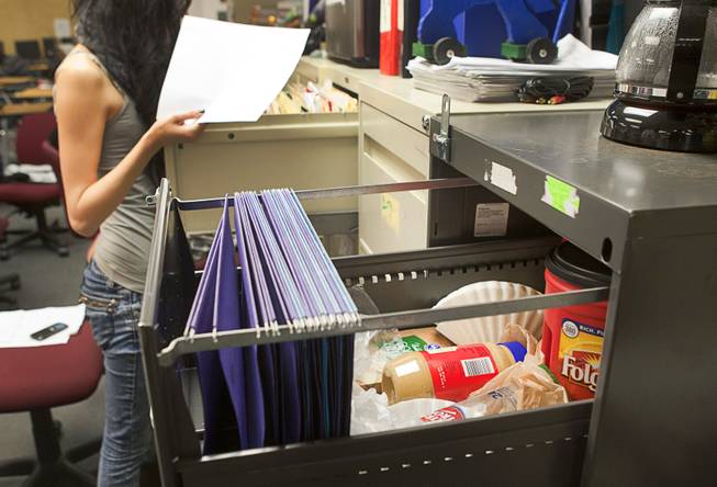 Coffee, bread and peanut butter are kept in a filing cabinet in an English classroom at Desert Rose Adult High School in North Las Vegas on Monday, Dec. 11, 2012. The teachers keep some food for the students in case they don't have enough to eat.