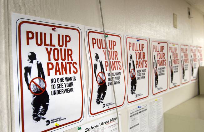 Signs discouraging sagging pants are posted in a classroom at Desert Rose Adult High School in North Las Vegas on Monday, Dec. 11, 2012.