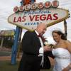 Randy Anderson and Jenni Lafollette of Minneapolis, Minn. look at a photo on their digital camera after getting married Wednesday, Dec. 12, 2012. Las Vegas wedding chapels were busy all day as many couples wanted to get married on the date of 12-12-12.