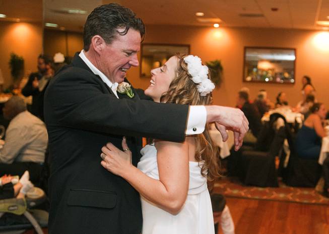 Clint Doucette and his bride Christina Infantino dance during a reception in the D Las Vegas downtown Wednesday, Dec. 12, 2012. Twelve couples got married at 12:12 pm at the Chapel of the Flowers as part of a KOMP 92.3 radio station promotion. The D Las Vegas put the couples up in newly upgraded rooms, hosted a reception and gave them tickets to "Marriage Can Be Murder," a comedy, murder-mystery dinner show.