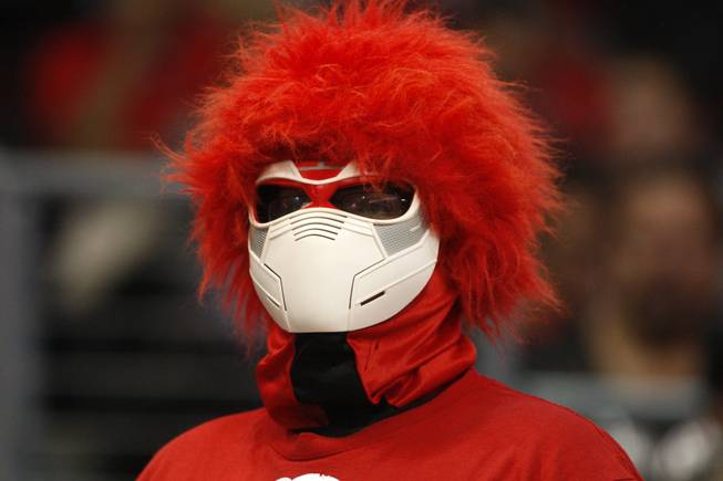 A Rebel fan watches UNLV's game against the La Verne Leopards at the Orleans Arena Thursday, Dec. 13, 2012.
