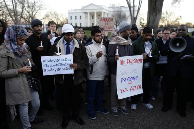 Supporters of gun control gather on Pennsylvania Avenue in front of the White House on Friday, Dec. 14, 2012, during a vigil for the victims of the shooting at Sandy Hook Elementary School in Newtown, Conn. They called on President Barack Obama to pass strong gun control laws.