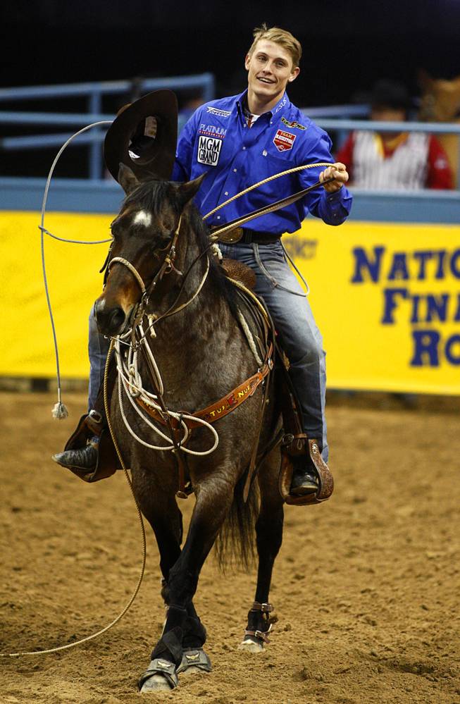 Tuf Cooper, 22, of Decatur, Texas won the world championship title in tie-down roping during the final night of the Wrangler National Finals Rodeo Saturday, Dec. 15, 2012.