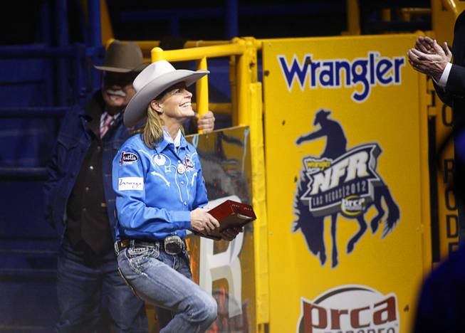 Barrel racer Mary Walker of Ennis, Texas is introduced during the final night of the Wrangler National Finals Rodeo Saturday, Dec. 15, 2012. Walker won the world title and the Ram Truck Top Gun Award, given to the top earner in a single event at the NFR.