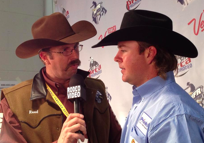 Jade Corkhill talks to the media Saturday night after being named world champion heeler in team roping at the Wrangler National Finals Rodeo in Las Vegas.