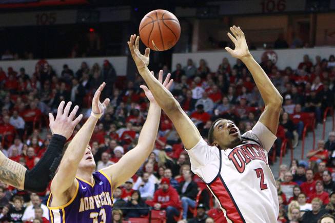 UNLV forward Khem Birch grabs a rebound from UNI center Austin Pehl during their game Wednesday, Dec. 19, 2012 at the Thomas & Mack. UNLV won 73-59 to push their record to 10-1.