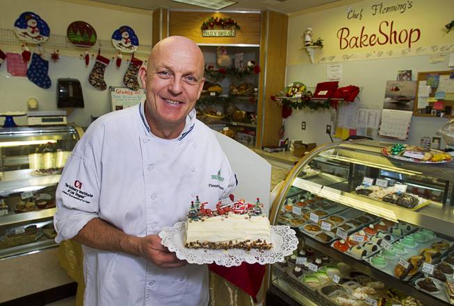 Chef Flemming Pedersen poses with a yule log at Chef Flemmings Bake Shop, a European-style bakery, on Water Street in downtown Henderson Thursday, Dec. 20, 2012.