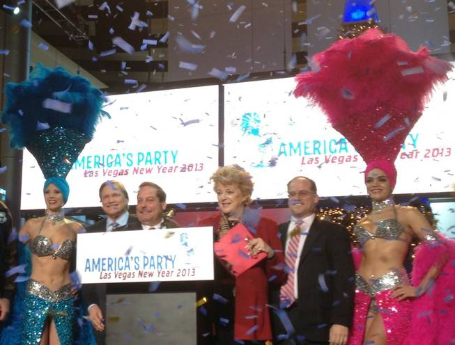 Las Vegas Mayor Carolyn Goodman is flanked by civic leaders and show girls during a press conference Dec. 20, 2012, at Fashion Show Mall to announce plans for New Year's Eve fireworks.