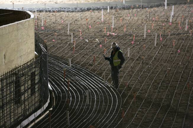 A construction worker checks the foundation ground for the wave pool prior to a concrete pour at Las Vegas' newest attraction Wet 'n' Wild, a 41-acre water park expected to open in Spring of 2013, Thursday, Dec. 20, 2012.