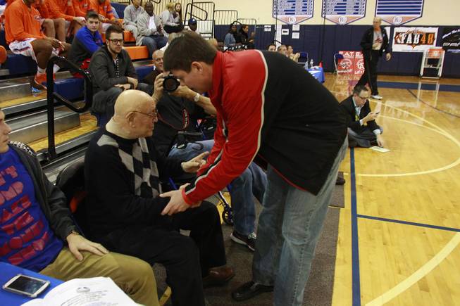Current UNLV basketball coach Dave RIce talks with former coach Jerry Tarkanian between games in the inaugural Jerry Tarkanian Classic Thursday, Dec. 20, 2012.