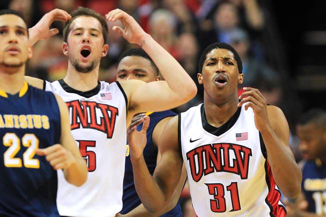 UNLV guards Katin Reinhardt, left, and Justin Hawkins react after getting called for a foul during their game against Canisius Saturday, Dec. 22, 2012 at the Thomas & Mack. The Runnin' Rebels won 89-74.