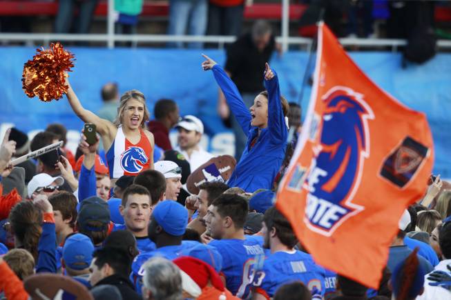 Boise State fans cheer on the field after the Broncos' 28-26 win over Washington in the Maaco Bowl Las Vegas on Saturday, Dec. 22, 2012, at Sam Boyd Stadium.