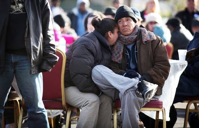 Byron Martin sits with his wife, who did not want her name used, during a Christmas Day event to feed and clothe the homeless and needy organized by the nonprofit organization Broken Chains in Las Vegas on Tuesday, December 25, 2012.