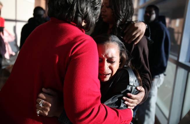 Brenda Morris, right, Jade Morris' grandmother, cries and hugs Jade's other grandmother Claudette Flanagan-Jones, in red, outside the courtroom after Brenda Stokes appeared in Las Vegas Justice Court for a hearing at the Regional Justice Center on Friday, December 28, 2012.
