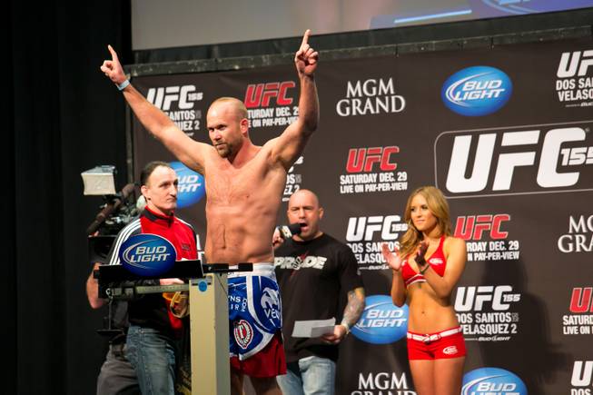 Middleweight Tim Boetsch poses on the scale during the weigh in for UFC 155, Friday, Dec. 28, 2012.
