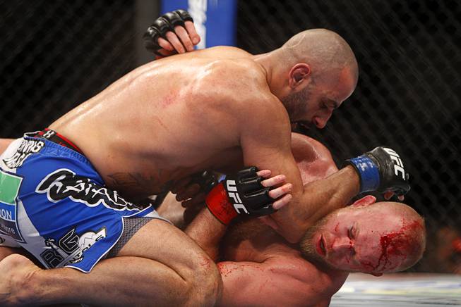 Costa Philippou of Long Island, N.Y. wrestles with Tim Boetsch of Sunbury, Penn. during a middleweight bout UFC155 at the MGM Grand Garden Arena Saturday, Dec. 29, 2012. Philippou won by third round TKO.