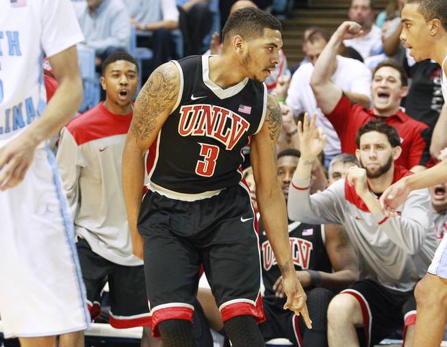UNLV guard Anthony Marshall signals a successful three-point shot against North Carolina during their game Saturday, Dec. 29, 2012 at the Dean Smith Center in Chapel Hill, N.C. North Carolina won the game 79-73.