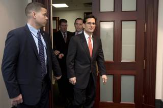House Majority Leader Eric Cantor of Va., right, leaves a Republican caucus meeting on Capitol Hill in Washington, Tuesday, Jan. 1, 2013. Cantor, the No. 2 Republican in the House leadership says he opposes a Senate-passed measure to avert the so-called fiscal cliff.