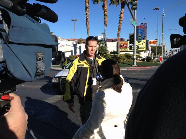 Metro Police Sgt. Richard Strader talks to the media after a fatal accident on Flamingo Road, Jan. 1, 2013.