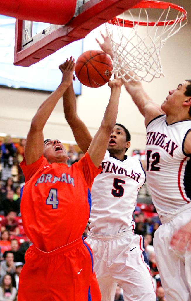 Trey Kennedy, from left, of Bishop Gorman battles with Christian Wood and Gavin Schilling of Findlay Prep during their boys basketball game at the South Point Arena in Las Vegas on Monday, January 7, 2013.