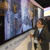 A reporter looks at a Sony X-Reality PRO 4K Ultra HD television during a Sony news conference at the 2013 International CES in the Las Vegas Convention Center Monday, January 7, 2013.