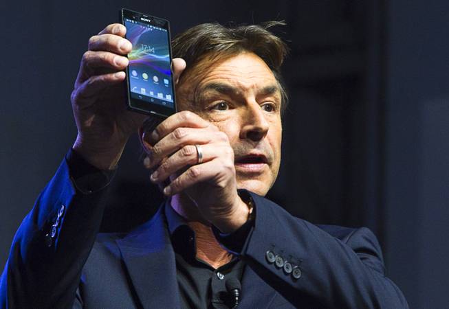 Phil Molyneux, president and COO of Sony Electronics Inc., displays a Sony Xperia Z smart phone during a Sony news conference at the 2013 International CES in the Las Vegas Convention Center Monday, January 7, 2013.
