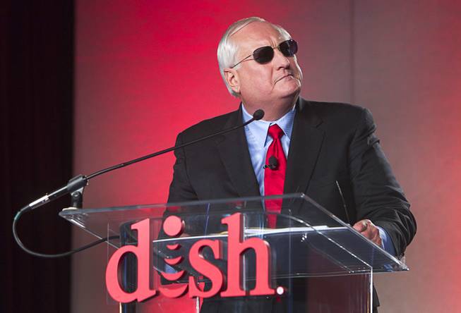 Dish CEO Joe Clayton poses wearing sunglasses during a Dish news conference at the 2013 International CES in the Mandalay Bay Convention Center Monday, January 7, 2013. Dish announced improvements to its Hopper DVR system including a built-in Slingbox that will allow consumers to view content on mobile devices without any extra cost.