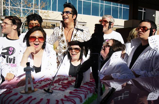 Elvis impersonator Jesse Garon, center, and members of the OV Elvi dance troupe and Roaring Thunder percussion team sing Happy Birthday with a cake during a celebration of Elvis Presley's birthday at Opportunity Village Engelstad Campus in Las Vegas on Tuesday, January 8, 2013.