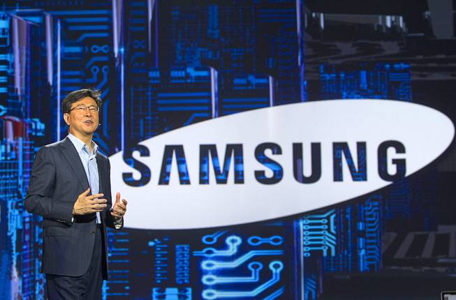 Stephen Woo, president of Device Solutions Business for Samsung Electronics, speaks during a keynote address at the 2013 International CES Wednesday January 9, 2013. Samsung introduced a new faster processor and prototype devices with flexible OLED screens.