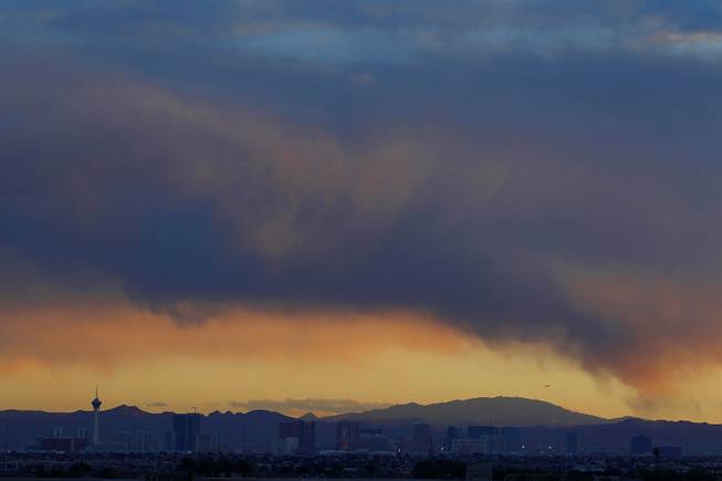 Clouds hang over the Las Vegas Valley as the sun sets behind the Spring Mountains Friday, Jan. 11, 2013.