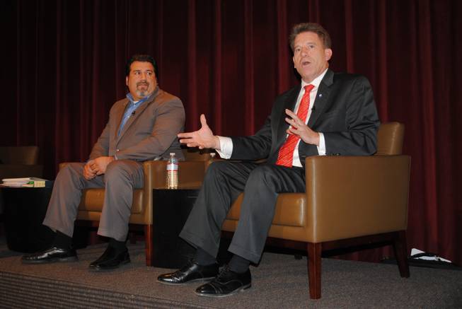 Panelists Andres Ramirez, left, president of the political consulting firm The Ramirez Group, and Minnesota Secretary of State Mark Ritchie discuss a voter ID proposal from Nevada Secretary of State Ross Miller.  A panel at UNLV on Friday discussed Miller's proposed plan, a new voting system would link with Department of Motorized Vehicle’s license database, allowing poll workers to visually verify the identity of the person attempting to vote in Nevada. 