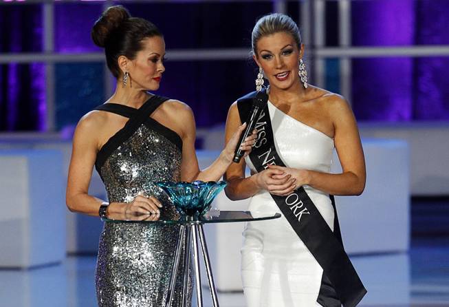 Miss New York Mallory Hytes Hagan, right, answers a question about gun control with co-host Brooke Burke-Charvet during the 2013 Miss America Pageant in PH Live at Planet Hollywood on Saturday, Jan. 12, 2013. Hagan was later named 2013 Miss America.