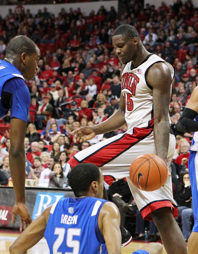 After scoring on him, UNLV forward Anthony Bennett drops the ball in Air Force guard Kyle Green's lap during their game Saturday, Jan. 12, 2013 at the Thomas & Mack. UNLV won in overtime, 76-71.