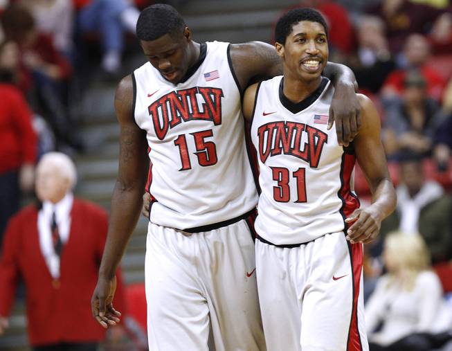 UNLV's Anthony Bennett walks off the court with his arm around teammate Justin Hawkins during their game against Air Force Saturday, Jan. 12, 2013 at the Thomas & Mack. UNLV won in overtime, 76-71.