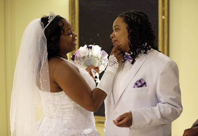 Darcia Anthony, left, and her partner, Danielle Williams, chat before participating in a marriage ceremony at City Hall in Baltimore, Tuesday, Jan. 1, 2013. Gay marriage is one of the social issues Nevada lawmakers will face this year.