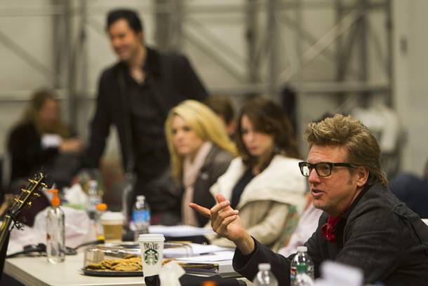 Musical director Chuck Mead, right, talks with cast members during a rehearsal for 