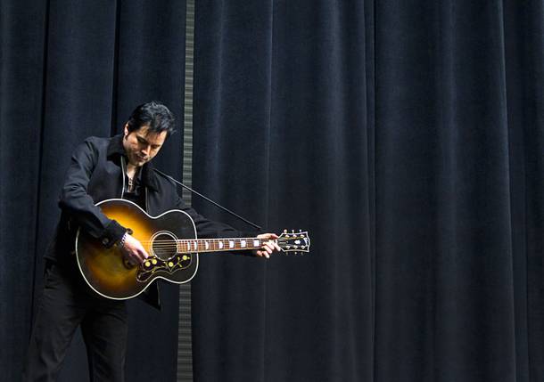 Cole, a Johnny Cash/Elvis Presley understudy, practices by himself during a rehearsal for 