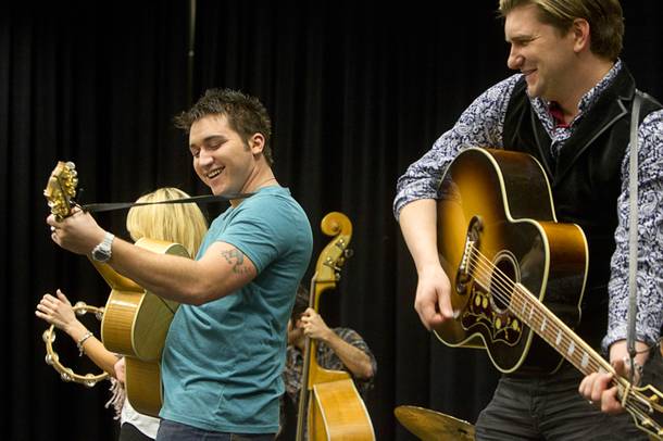 Tyler Hunter, left, as Elvis Presley and Benjamin D. Hale as Johnny Cash perform during a rehearsal for 