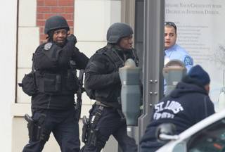 Police respond to the report of a shooting at Stevens Institute of Business and Arts in St. Louis on Tuesday, Jan. 15, 2013.  
