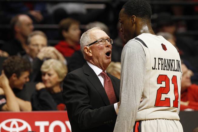 San Diego State head coach Steve Fisher talks with guard Jamaal Franklin during a break in their game against UNLV Wednesday, Jan. 16, 2013 at Viejas Arena in San Diego. UNLV upset SDSU 82-75.