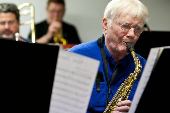 Roger Hall, 87, sight reads while playing the alto saxophone with other old-time big-band musicians during the Thursday Night Band jam session in the Garage in Henderson on Thursday, Jan. 18, 2013.