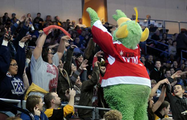 Wrangler mascot "The Duke" entices fans to participate in starting a wave during a stoppage in play on Saturday night as Las Vegas hosted the Colorado Eagles at the Orleans Arena.