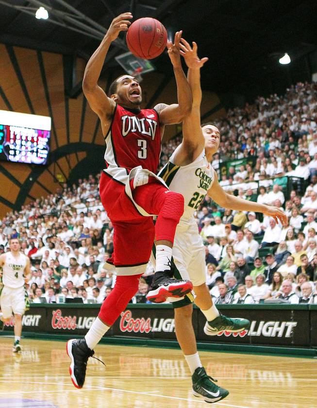 UNLV guard Anthony Marshall is fouled by Colorado State guard Dorian Green during their game Saturday, Jan. 19, 2013 at Moby Arena in Ft. Collins, Colo. Colorado State won the game 66-61.