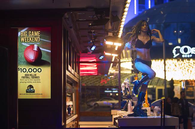 A dancer performs outside the Golden Gate casino in downtown Las Vegas, Sunday, Jan. 20, 2013.