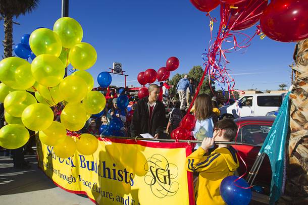 Members of the Soka Gakkai International (SGI) buddhist group prepare for the start of the 31st annual Martin Luther King Jr. parade in downtown Las Vegas, Monday, Jan. 21, 2013. MGM Resorts International was the presenting sponsor for the event.