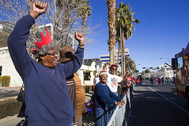Spectator Pat Brooks, left, cheers during the 31st annual Martin Luther King Jr. parade in downtown Las Vegas, Monday, Jan. 21, 2013. MGM Resorts International was the presenting sponsor for the event.