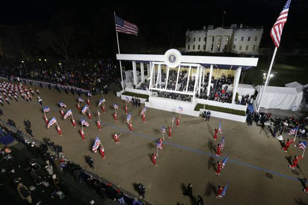 Boston Crusaders Drum & Bugle Corps, Massachusetts perform while passing the presidential box and the White House during the Inaugural parade , Monday, Jan. 21, 2013, in Washington. Thousands  marched during the 57th Presidential Inauguration parade after the ceremonial swearing-in of President Barack Obama. 