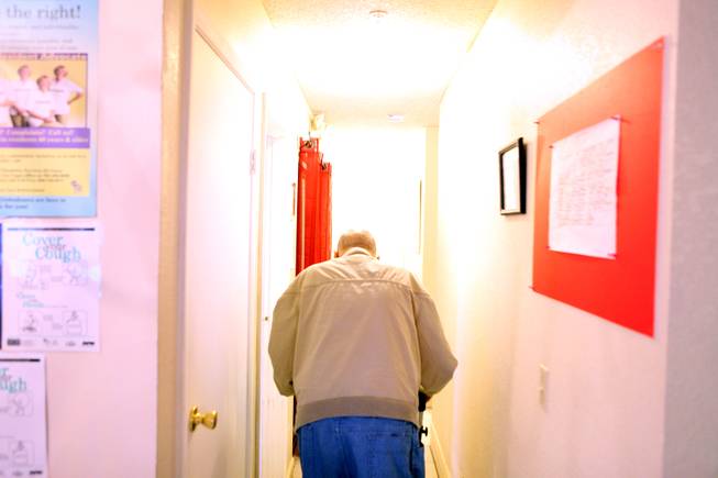 A resident walks down the hall at Sweet Home Belmont, an assisted living facility for seniors in Henderson on Tuesday, January 22, 2013.